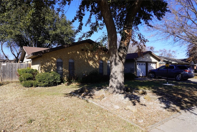 view of side of property featuring a garage