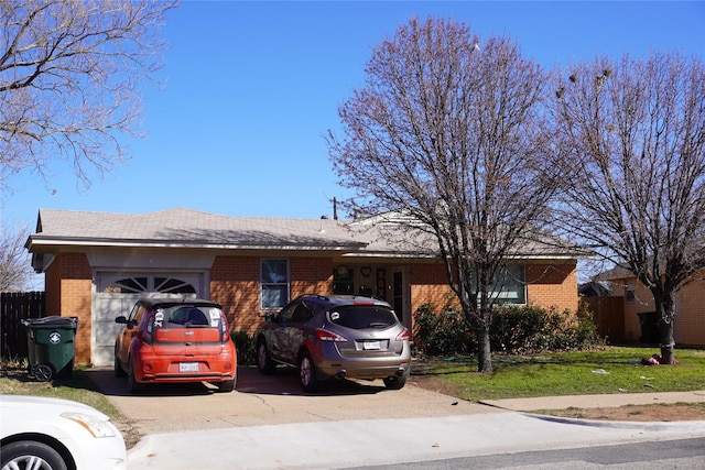 ranch-style home with a garage and a front lawn