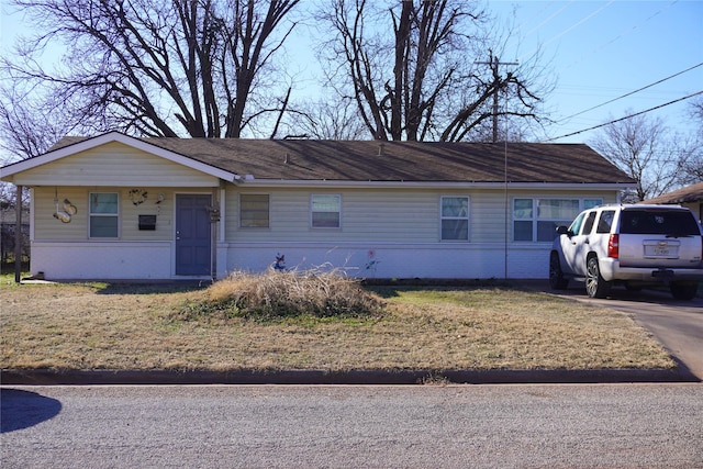 ranch-style house with a front lawn