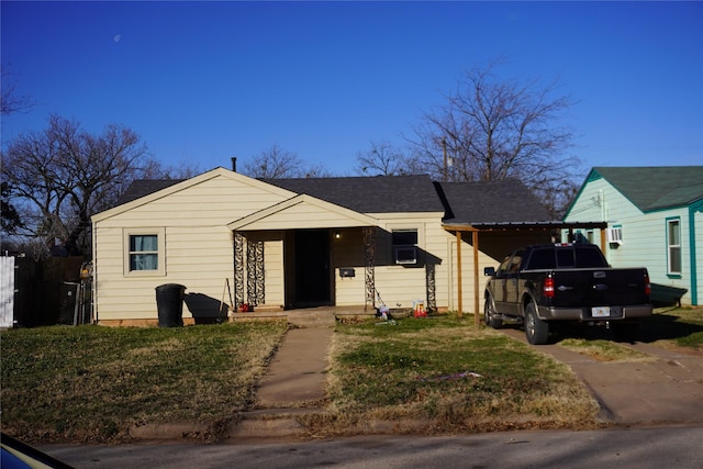 view of front facade with a carport