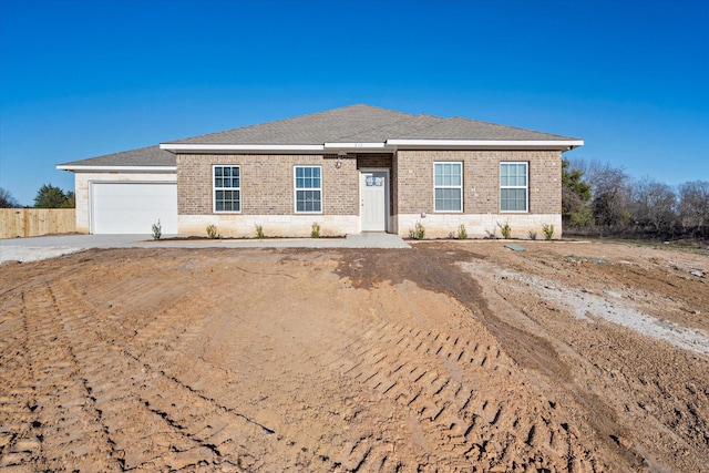 ranch-style home featuring a garage