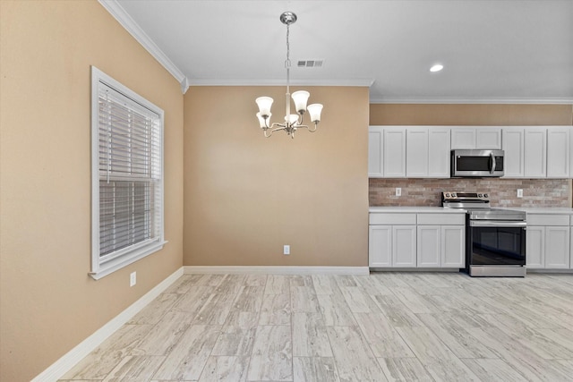 kitchen with crown molding, white cabinetry, hanging light fixtures, stainless steel appliances, and decorative backsplash