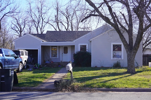 single story home with a garage and a front yard