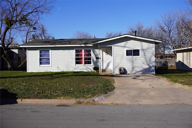 single story home featuring a front yard