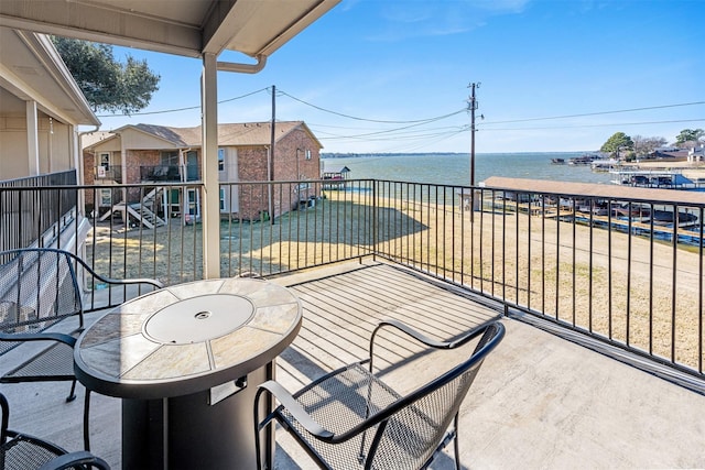 balcony featuring a water view