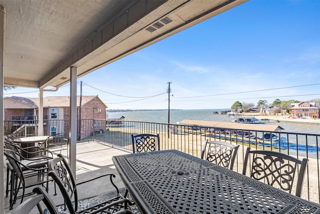 balcony featuring a water view