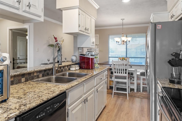 kitchen featuring black dishwasher, sink, white cabinets, hanging light fixtures, and crown molding