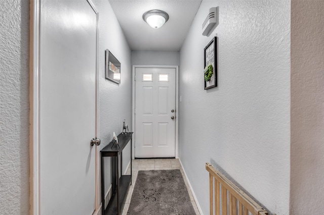 doorway to outside featuring light tile patterned floors