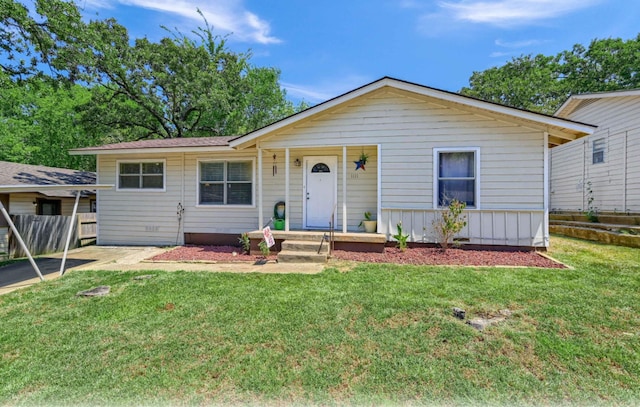 ranch-style house featuring a front lawn