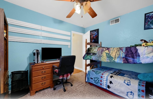 bedroom with light carpet and ceiling fan