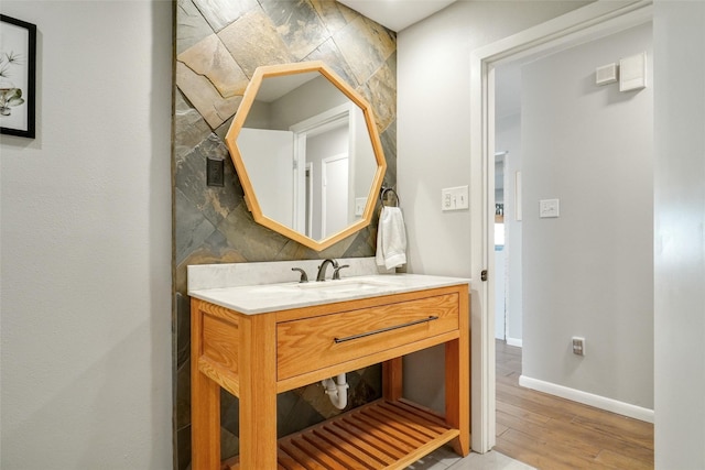 bathroom with vanity and hardwood / wood-style floors