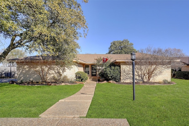 ranch-style home with a front yard