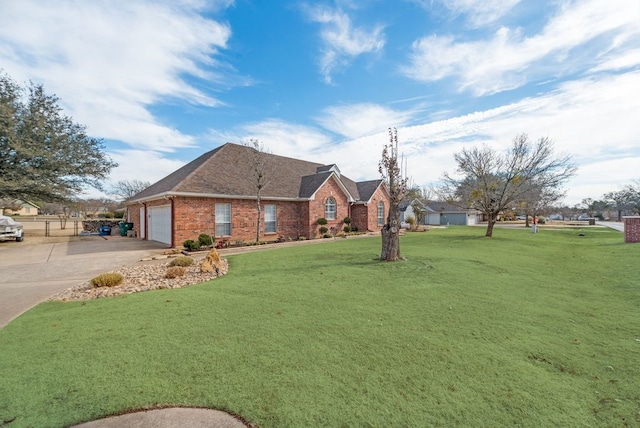 view of front of property with a garage and a front yard