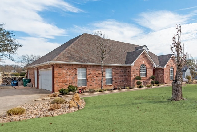 single story home featuring a garage and a front lawn