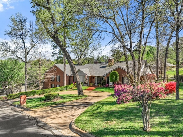 ranch-style home with a front yard