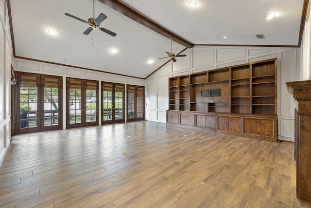 unfurnished living room with lofted ceiling with beams, ceiling fan, and light hardwood / wood-style floors