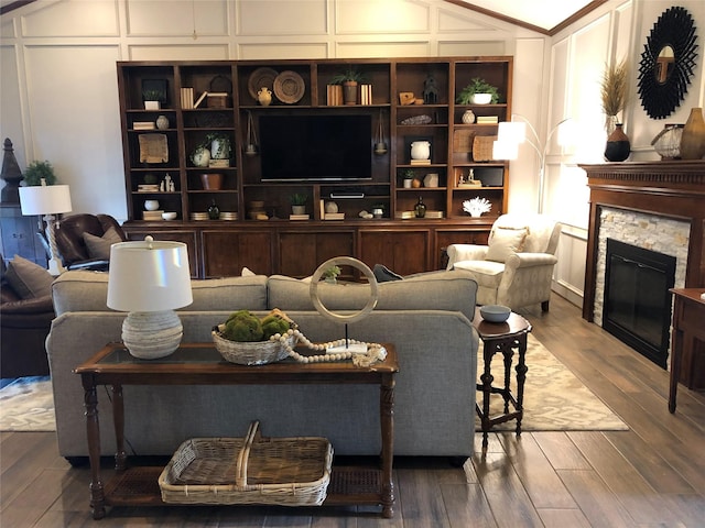 living room featuring hardwood / wood-style flooring and a fireplace