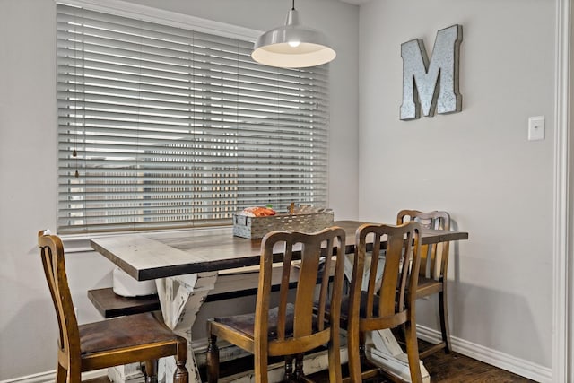 dining space with hardwood / wood-style floors