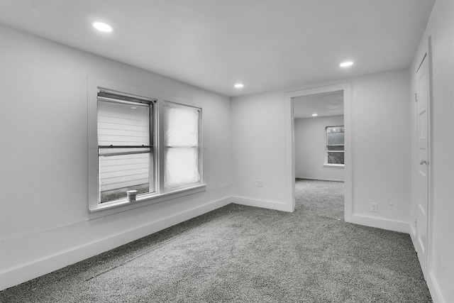 unfurnished room featuring carpet flooring