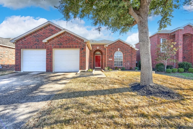 view of front of house featuring a garage and a front yard