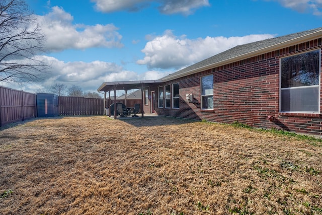 exterior space with a lawn and a patio area