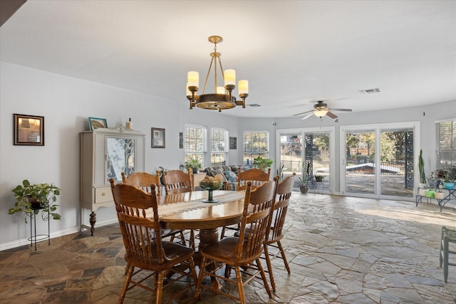 dining area featuring ceiling fan with notable chandelier and a wealth of natural light