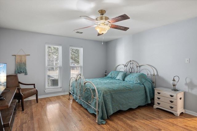 bedroom featuring hardwood / wood-style floors and ceiling fan