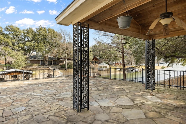 view of patio featuring ceiling fan