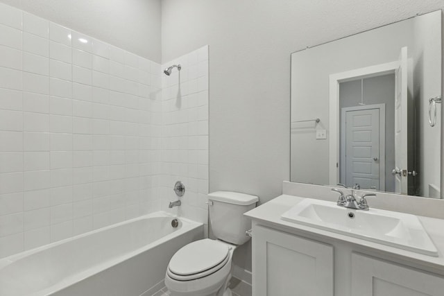 full bathroom featuring vanity, bathtub / shower combination, and toilet