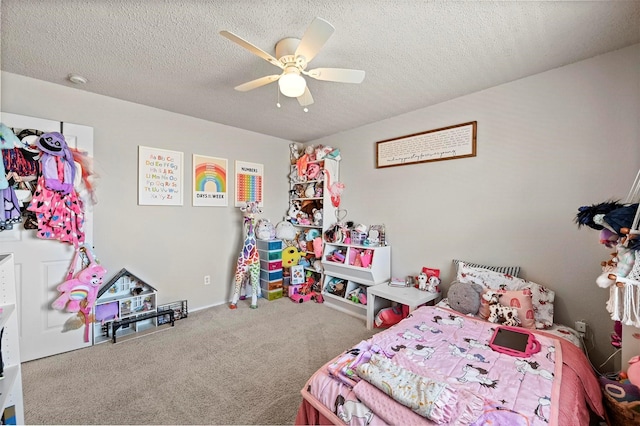 bedroom featuring a textured ceiling, carpet floors, and ceiling fan