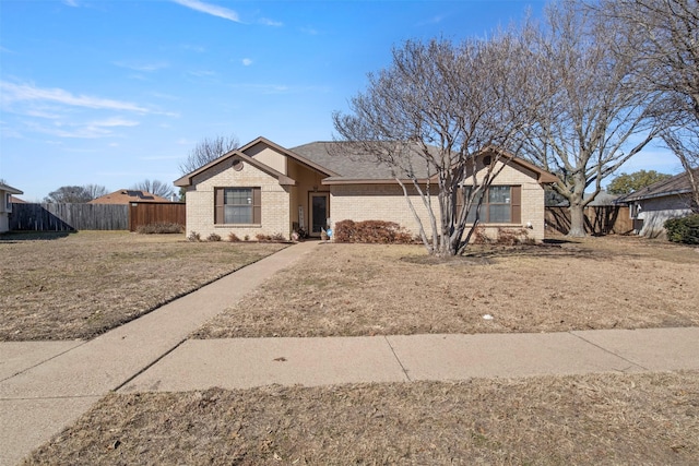 ranch-style home with a front lawn