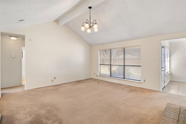 carpeted spare room with vaulted ceiling with beams and a notable chandelier