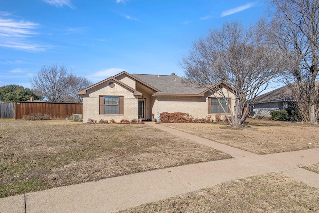 ranch-style home with a front lawn