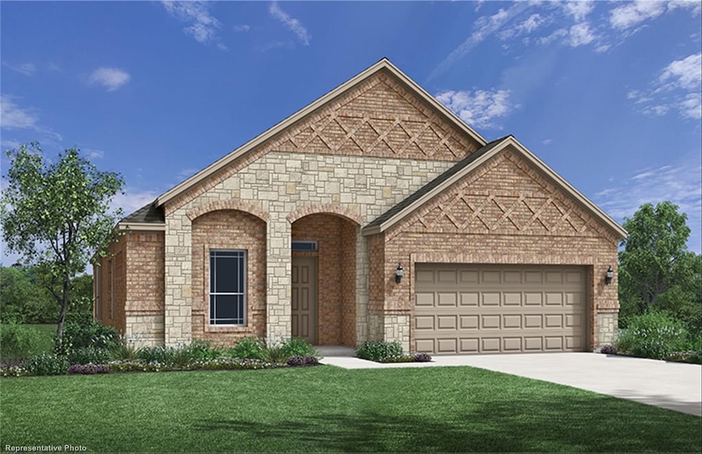 view of front facade with a garage and a front lawn