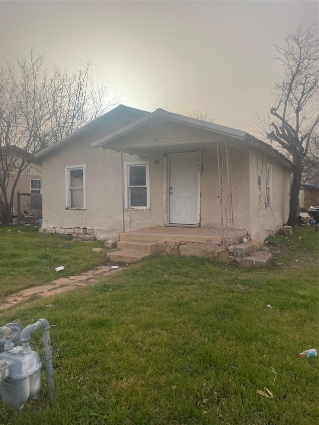 view of front of home with a front yard