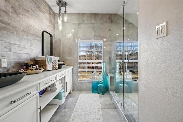 bathroom with vanity and concrete floors