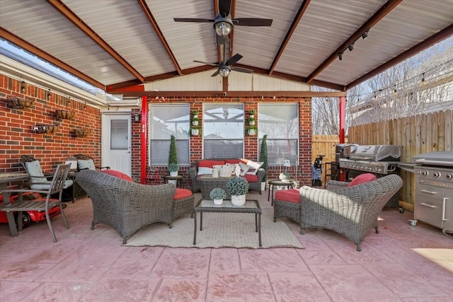 view of patio featuring an outdoor living space, area for grilling, and ceiling fan