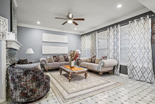 living room with crown molding, ceiling fan, a stone fireplace, and a textured ceiling