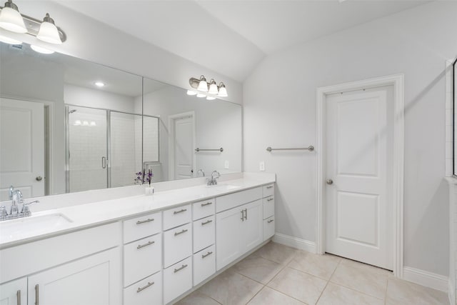 bathroom featuring tile patterned floors, a shower with shower door, vaulted ceiling, and vanity