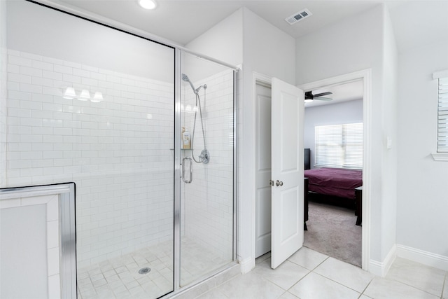 bathroom featuring tile patterned floors, ceiling fan, and walk in shower