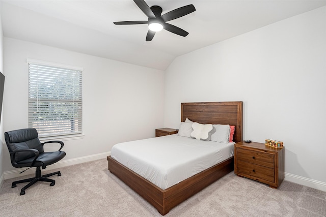 bedroom featuring lofted ceiling, light carpet, and ceiling fan