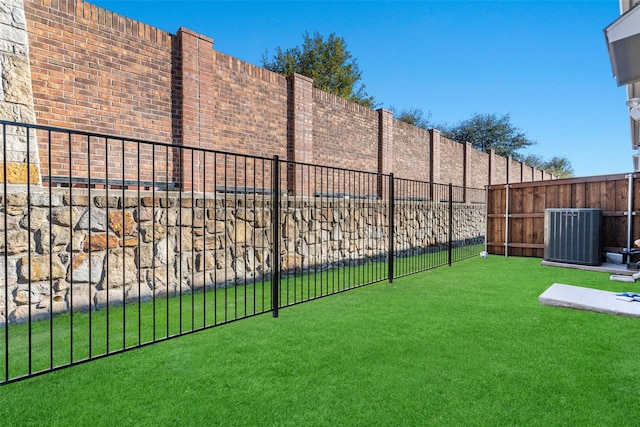 view of yard featuring central AC