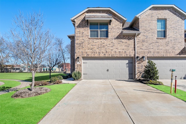 view of front facade featuring a garage and a front lawn