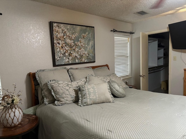 bedroom featuring a textured ceiling