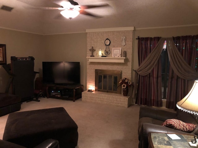 living room featuring crown molding, a brick fireplace, a textured ceiling, ceiling fan, and carpet