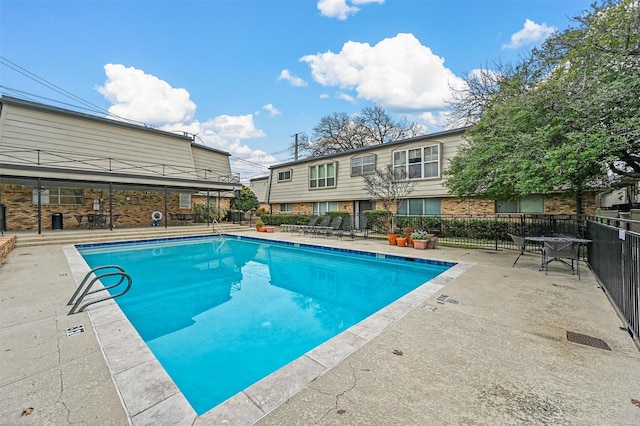 view of swimming pool featuring a patio