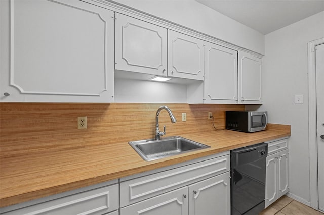 kitchen with white cabinetry, dishwasher, and sink