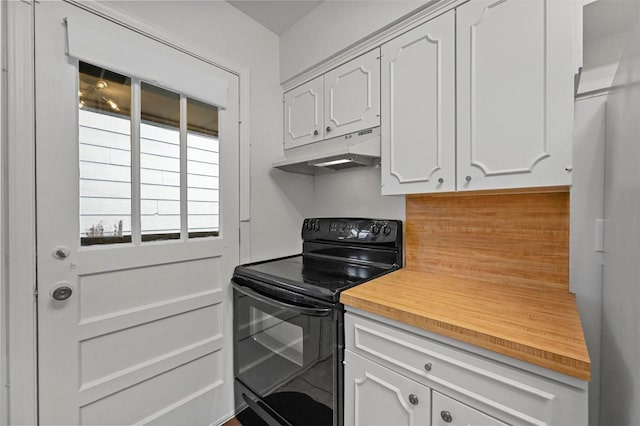 kitchen with white cabinetry, black / electric stove, and butcher block counters