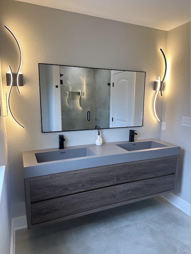 bathroom featuring vanity and an enclosed shower