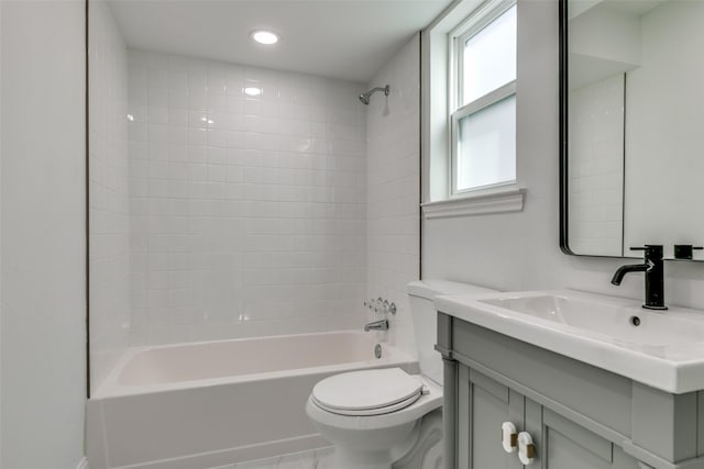 full bathroom featuring vanity, tub / shower combination, and toilet